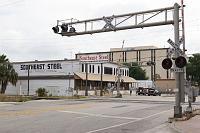  The CSX track crossing on Amelia Street.  The Southeast Steel building is a former citrus warehouse which dates back to the 1930's.